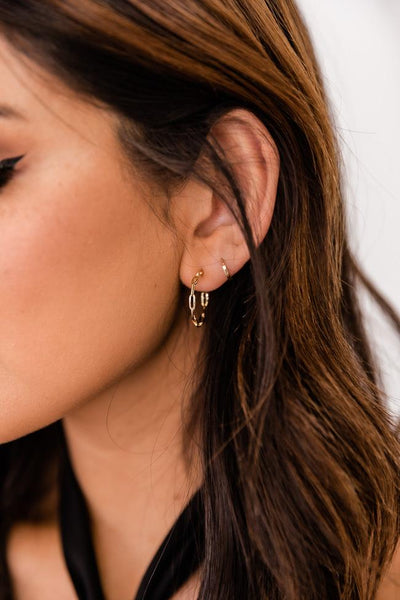 On The Clock Gold Twisted Huggie Earrings