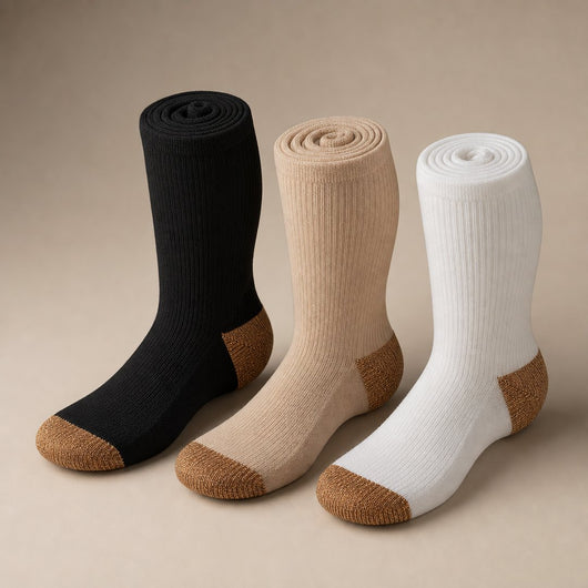 The three colorways rolled, showing the copper toe and heel